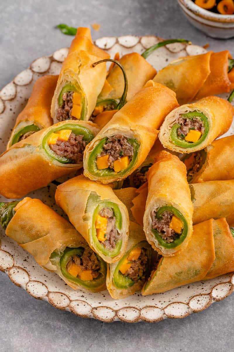 A plate of sliced Dynamite Lumpia.